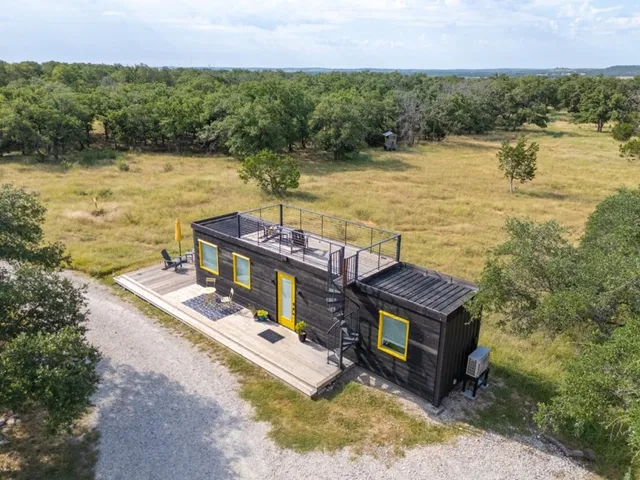 a view of a garden with sitting area