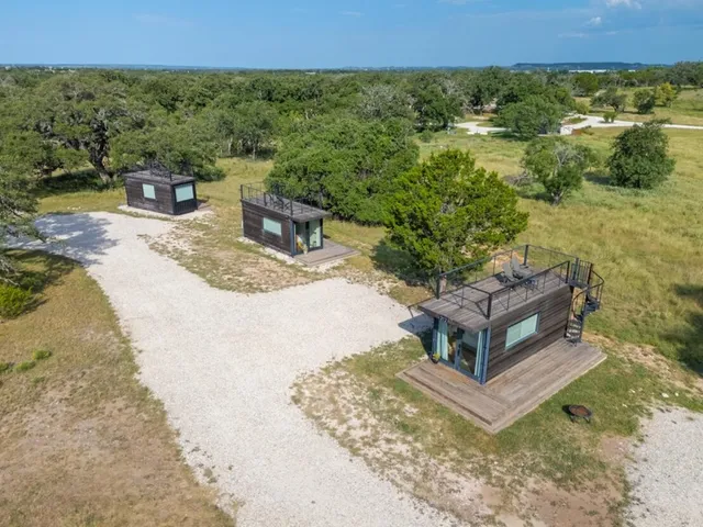 an aerial view of residential houses with outdoor space