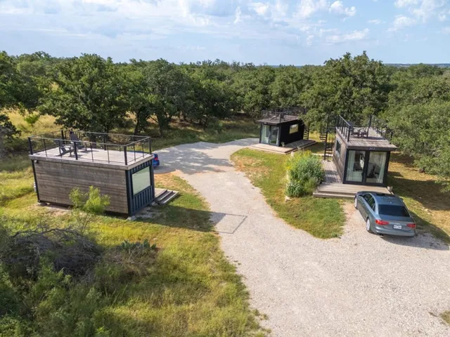 a view of a swimming pool with a yard