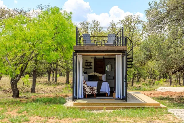 a bedroom with bed and a couch