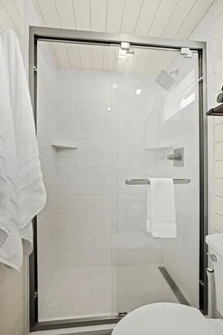 a view of deck with furniture and trees