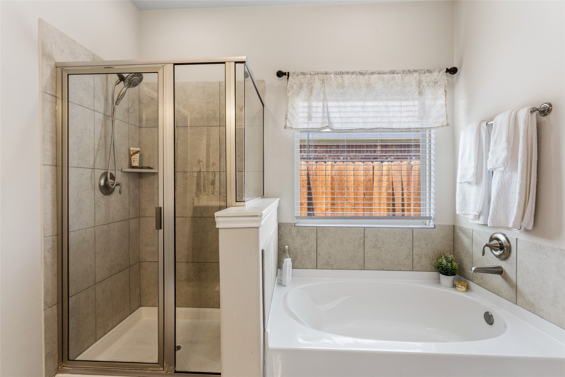 7254 Victorville Drive Rosharon, TX 77583 - Photo 11 of 27 a bathroom with a bathtub and a shower