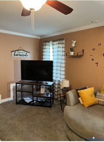 3732 Birdwood Road Richmond, VA 23234 - Photo 23 of 28 a living room with furniture and a flat screen tv