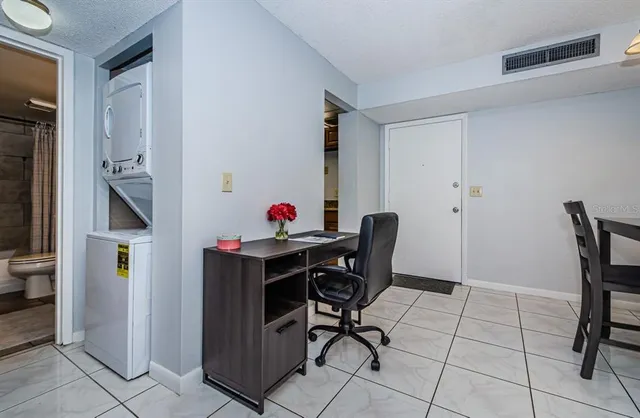 a view of a workspace with furniture