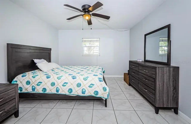 a bedroom with a bed and a dresser