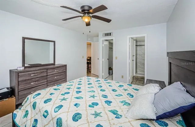 a bedroom with a bed and a dresser