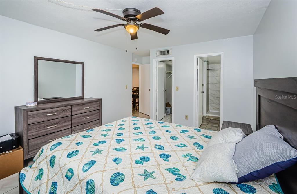 801 Russell Lane, Unit 255 Brandon, FL 33510 - Photo 20 of 38 a bedroom with a bed and a dresser