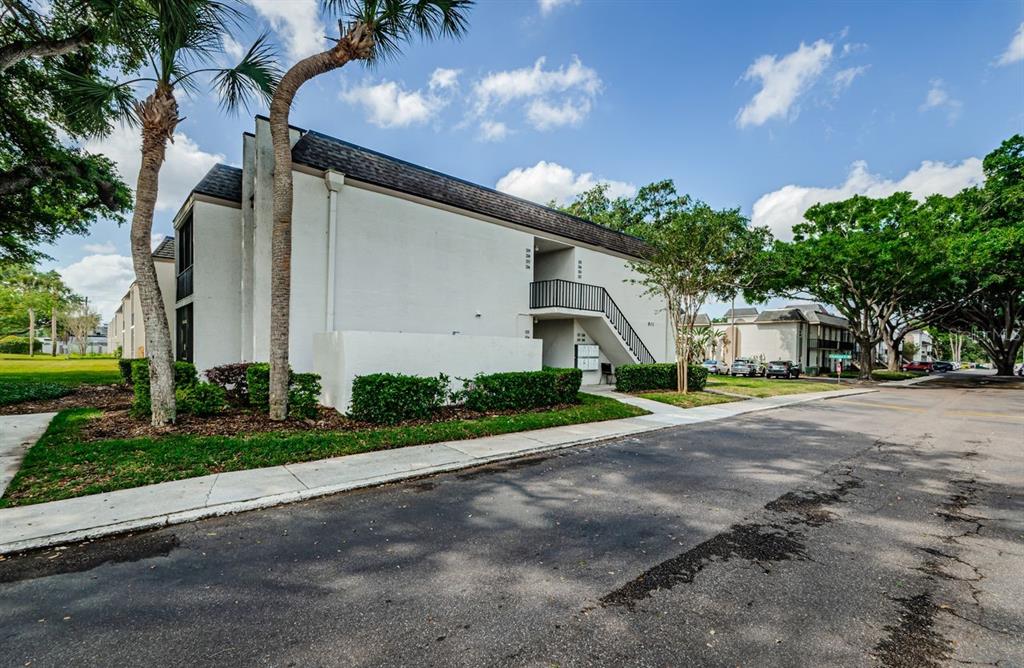 801 Russell Lane, Unit 255 Brandon, FL 33510 - Photo 2 of 38 a front view of a house with a yard and a garage