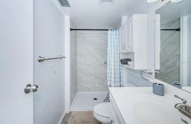 a bathroom with a sink and toilet