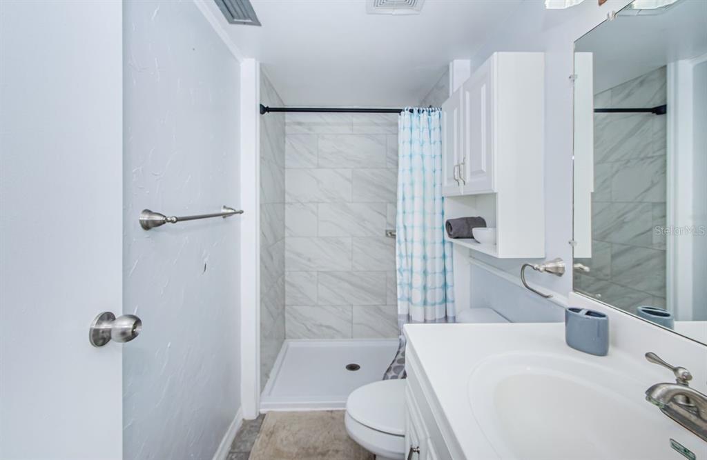 801 Russell Lane, Unit 255 Brandon, FL 33510 - Photo 23 of 38 a bathroom with a sink and toilet