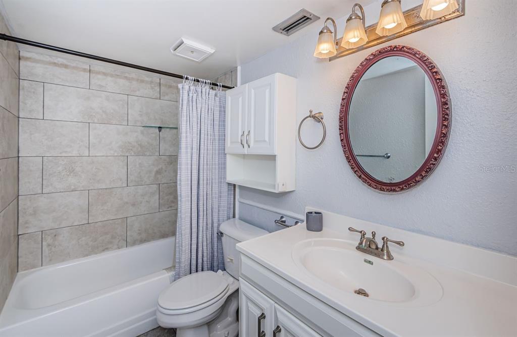 801 Russell Lane, Unit 255 Brandon, FL 33510 - Photo 26 of 38 a bathroom with a sink a toilet and shower