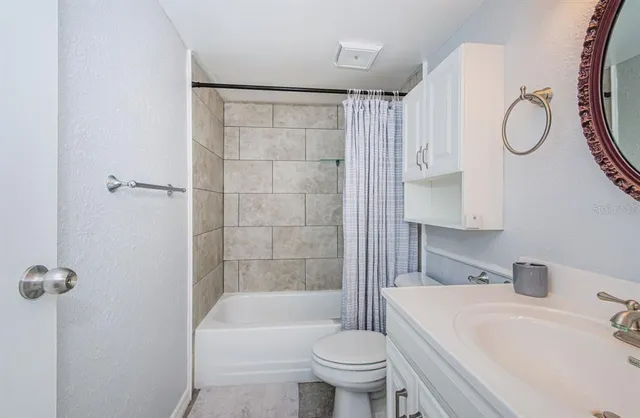 a bathroom with a sink a toilet and a bathtub