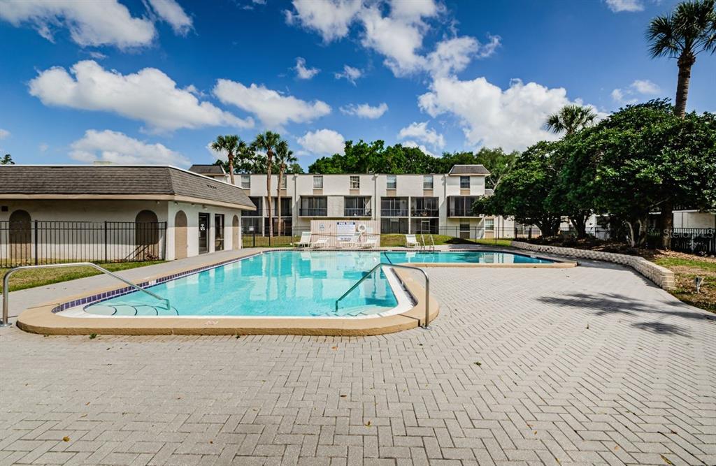 801 Russell Lane, Unit 255 Brandon, FL 33510 - Photo 35 of 38 a view of swimming pool and trees in the background
