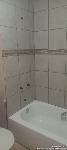 a bathroom with a bathtub