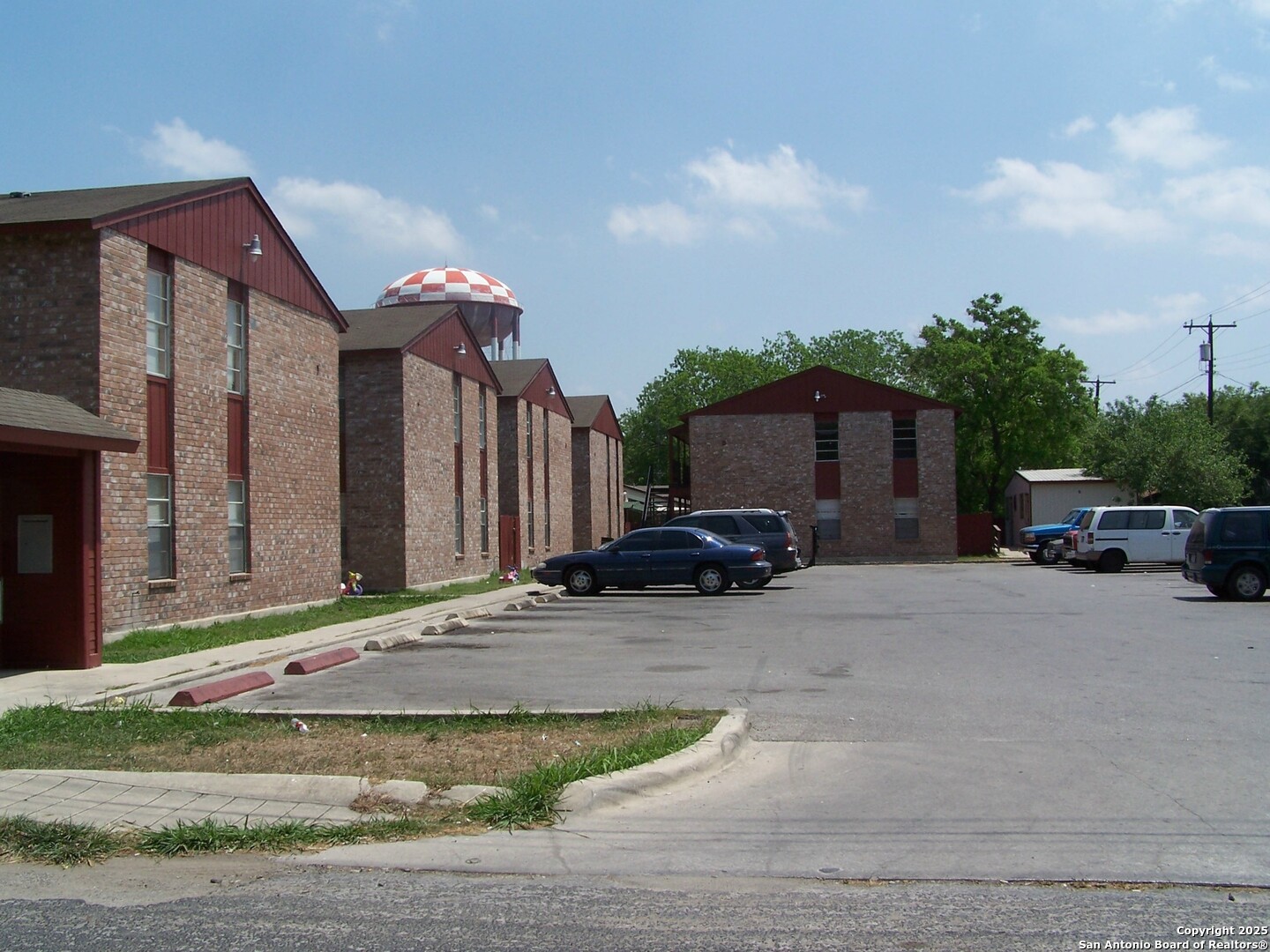 201 East Dullnig Court, Unit 9 San Antonio, TX 78223 - Photo 5 of 6 a view of a car parked in front of a house