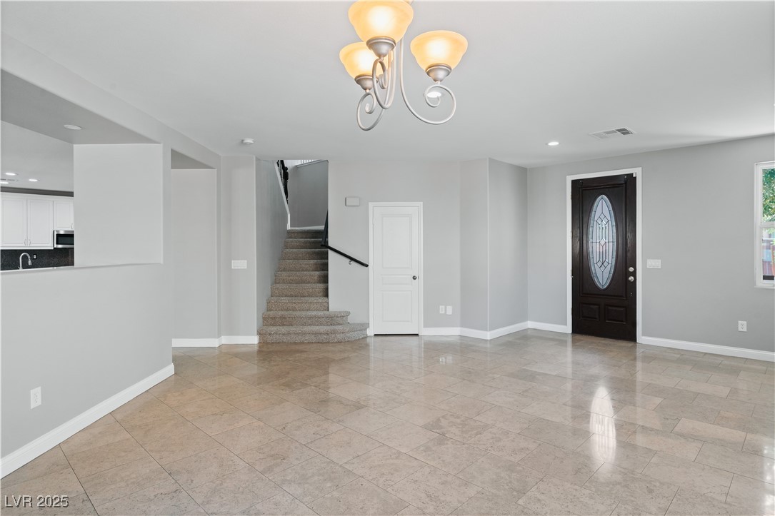 312 Pocono Ranch Avenue North Las Vegas, NV 89031 - Photo 13 of 34 Entryway featuring recessed lighting, stairway, a chandelier, visible vents, and baseboards
