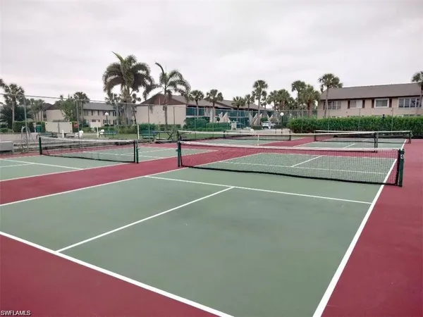 a tennis court that has tennis net