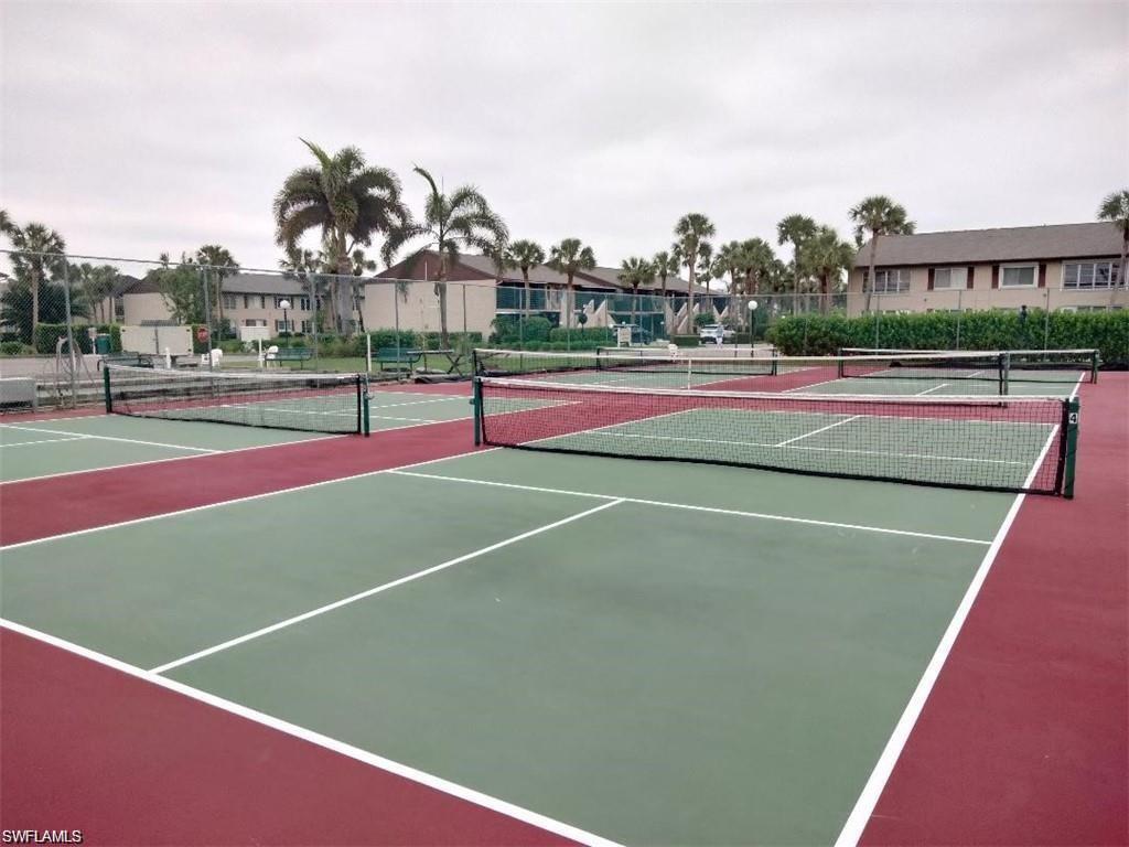 3618 Arctic Circle, Unit 3618 Naples, FL 34112 - Photo 11 of 11 a tennis court that has tennis net