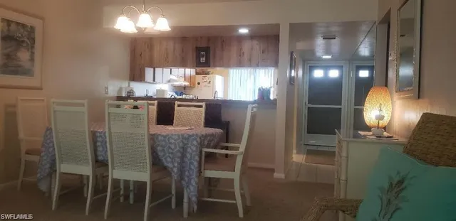 a kitchen with refrigerator and window