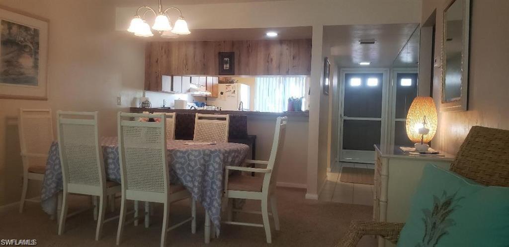 3618 Arctic Circle, Unit 3618 Naples, FL 34112 - Photo 4 of 11 a kitchen with refrigerator and window