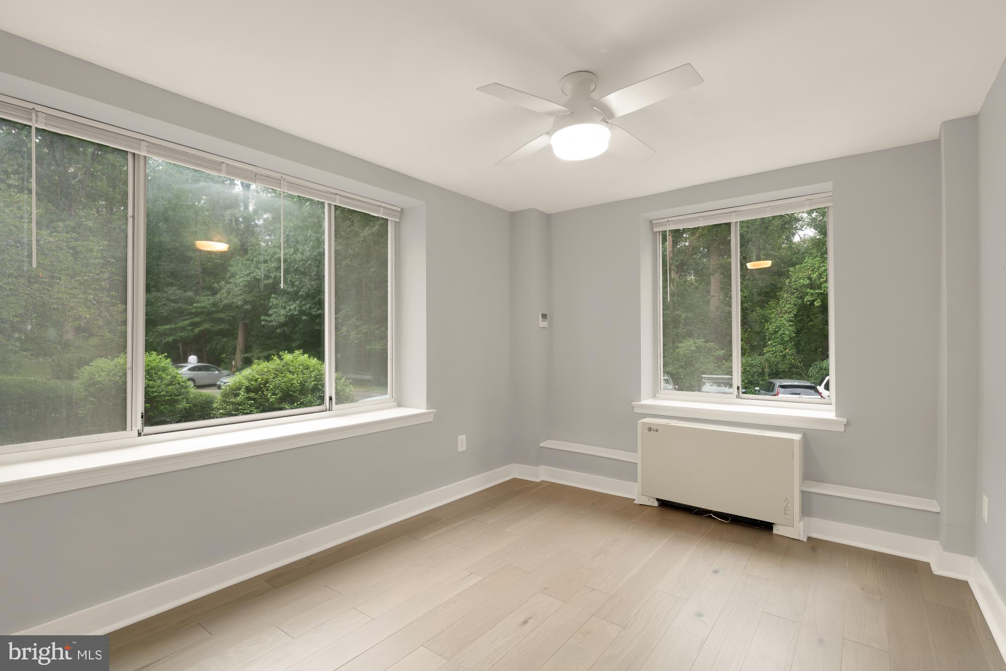4100 W Street Northwest, Unit 101 Washington, DC 20007 - Photo 21 of 28 Bright bedroom with nature views