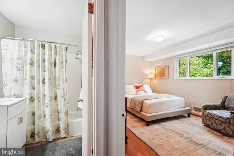 a bedroom with bed and a window