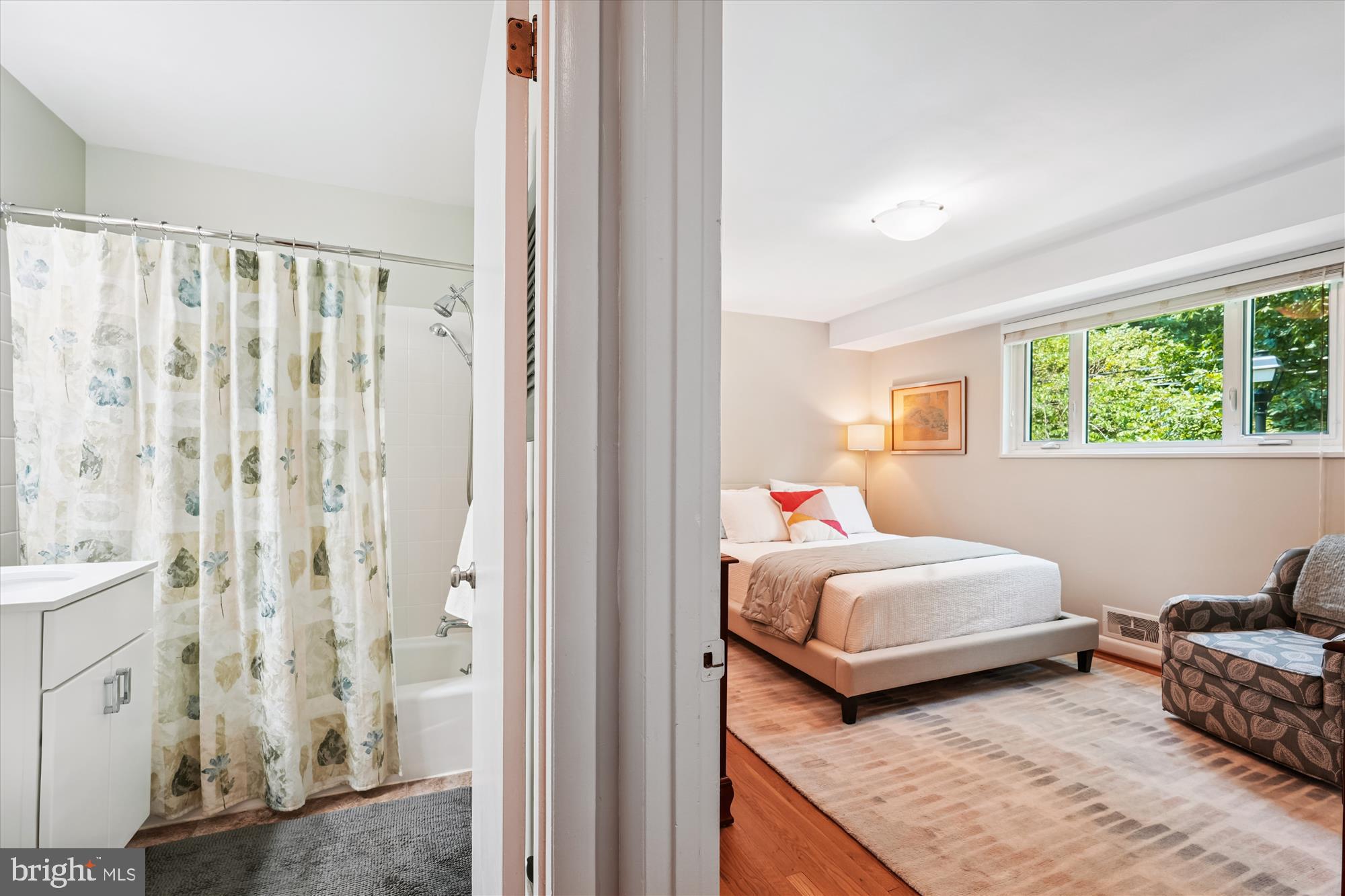 10427 Montrose Avenue, Unit 104 Bethesda, MD 20814 - Photo 15 of 37 a bedroom with bed and a window