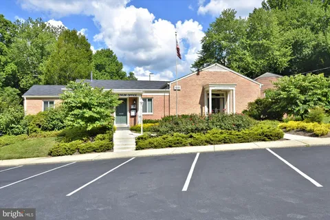 a front view of a house with a yard and a garage