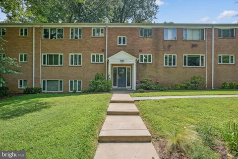 front view of a house next to a yard