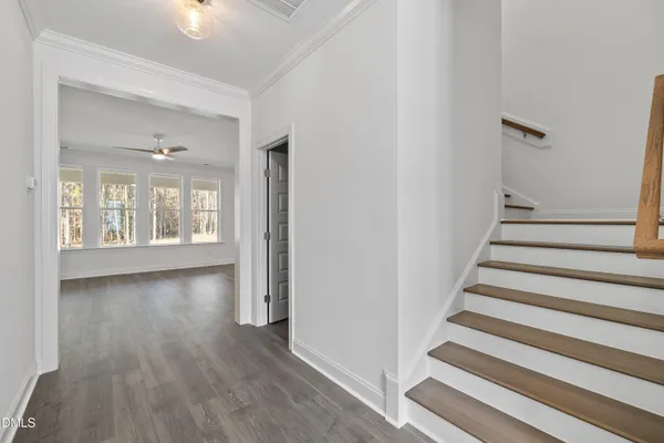 a view of an entryway with wooden floor