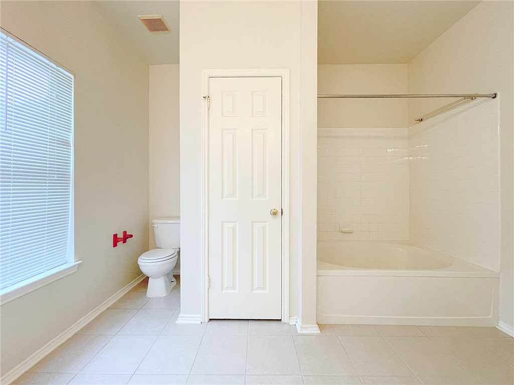 2211 Little Tree Bend Cedar Park, TX 78613 - Photo 16 of 23 a bathroom with a toilet and a shower