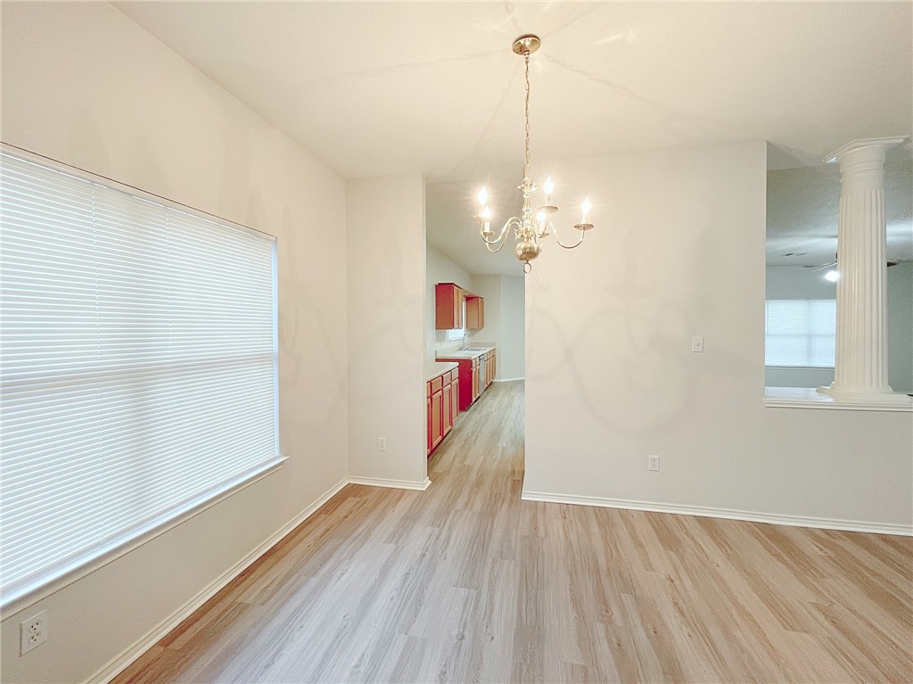 2211 Little Tree Bend Cedar Park, TX 78613 - Photo 5 of 23 a view of a room with wooden floor and cabinet