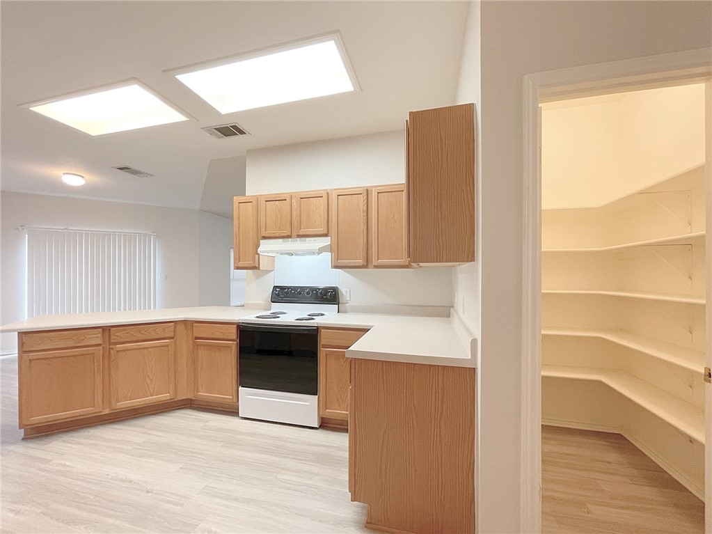 2211 Little Tree Bend Cedar Park, TX 78613 - Photo 6 of 23 a kitchen with stainless steel appliances a sink stove and cabinets