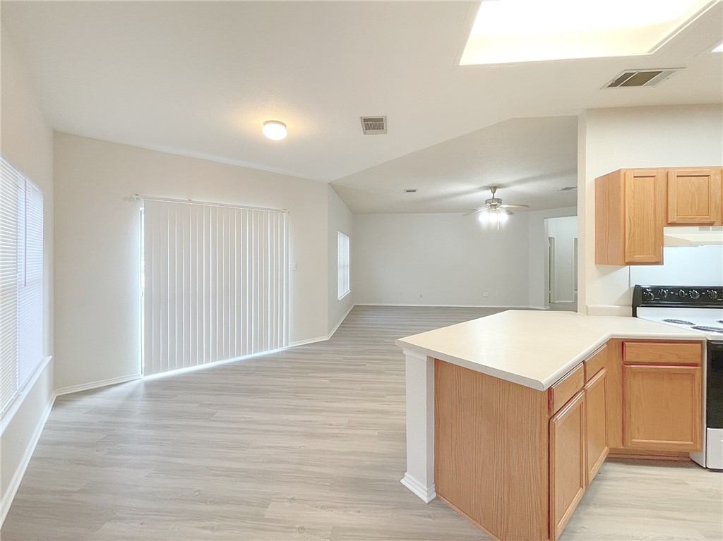 2211 Little Tree Bend Cedar Park, TX 78613 - Photo 8 of 23 a view of kitchen cabinets and wooden floor