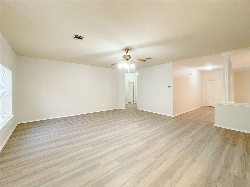 2211 Little Tree Bend Cedar Park, TX 78613 - Photo 9 of 23 an empty room with wooden floor and windows