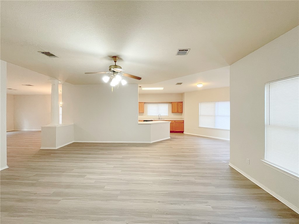 2211 Little Tree Bend Cedar Park, TX 78613 - Photo 10 of 23 a view of an empty room with a kitchen