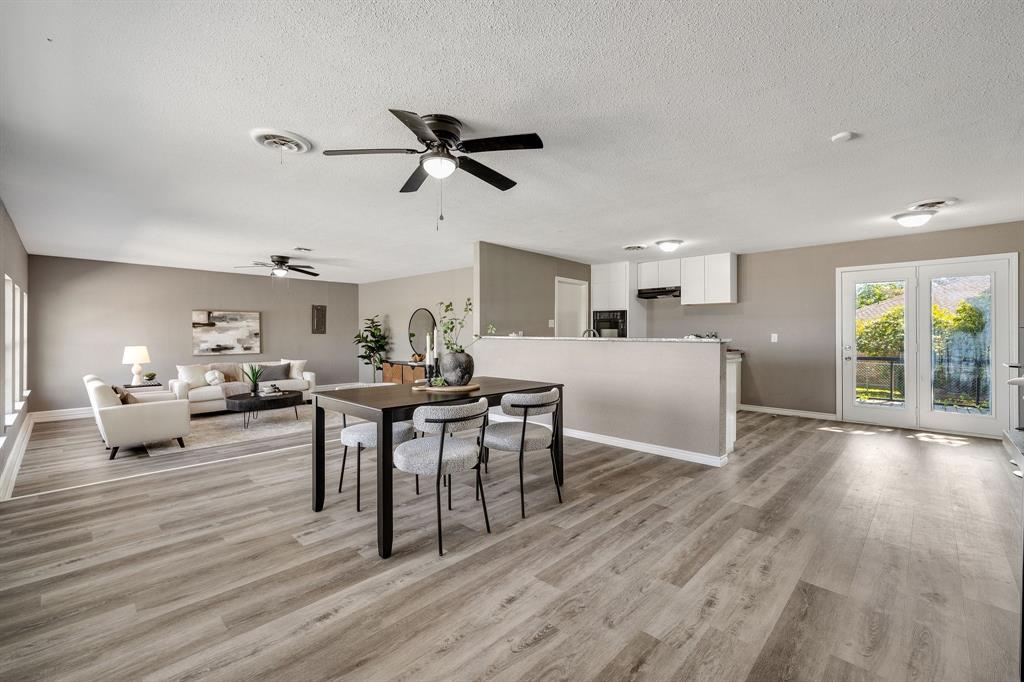 3301 South Murvil Street Decatur, TX 76234 - Photo 2 of 28 The expansive, open interior space has been updated with modern hues and LVP flooring throughout for easy maintenance.