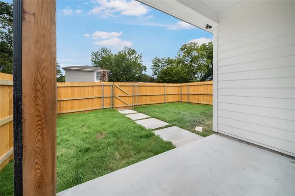 a view of backyard with green space