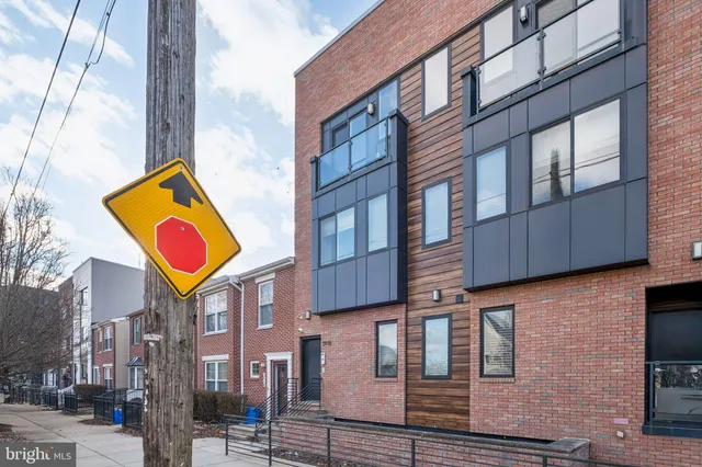 a street sign on a pole on a street