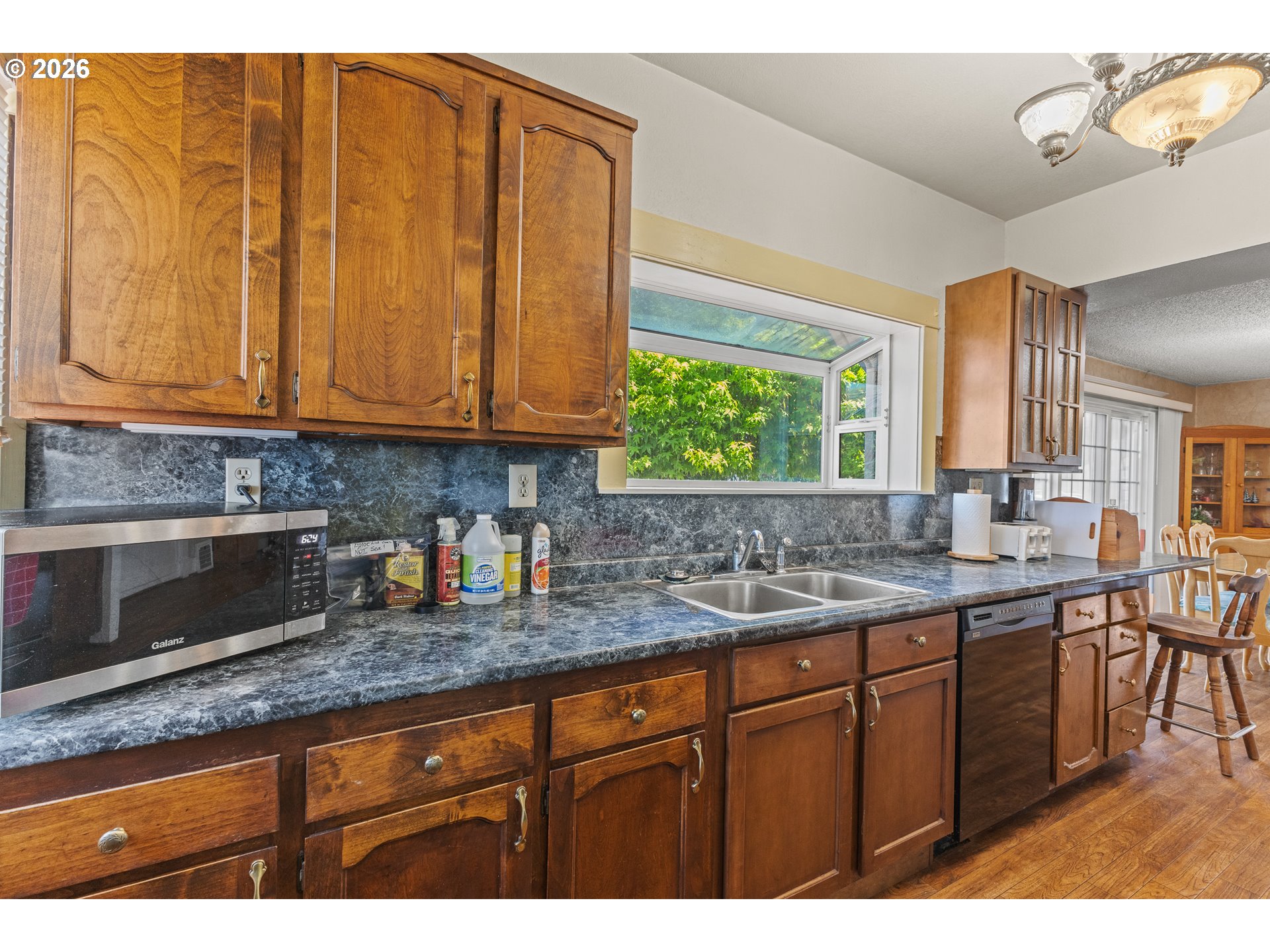 208 7th Street Myrtle Point, OR 97458 - Photo 20 of 48 a kitchen with stainless steel appliances granite countertop wooden cabinets a sink and dishwasher