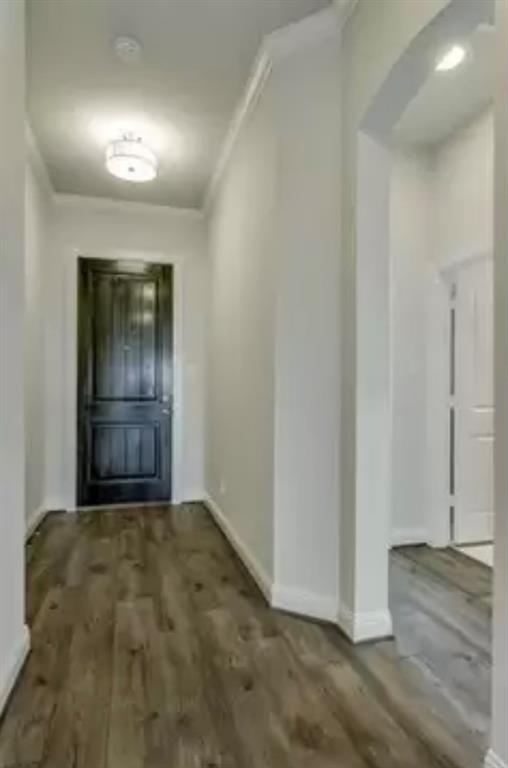 a view of a big room with wooden floor and brick wall