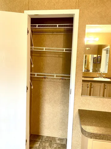 a view of a bathroom with a glass shower door