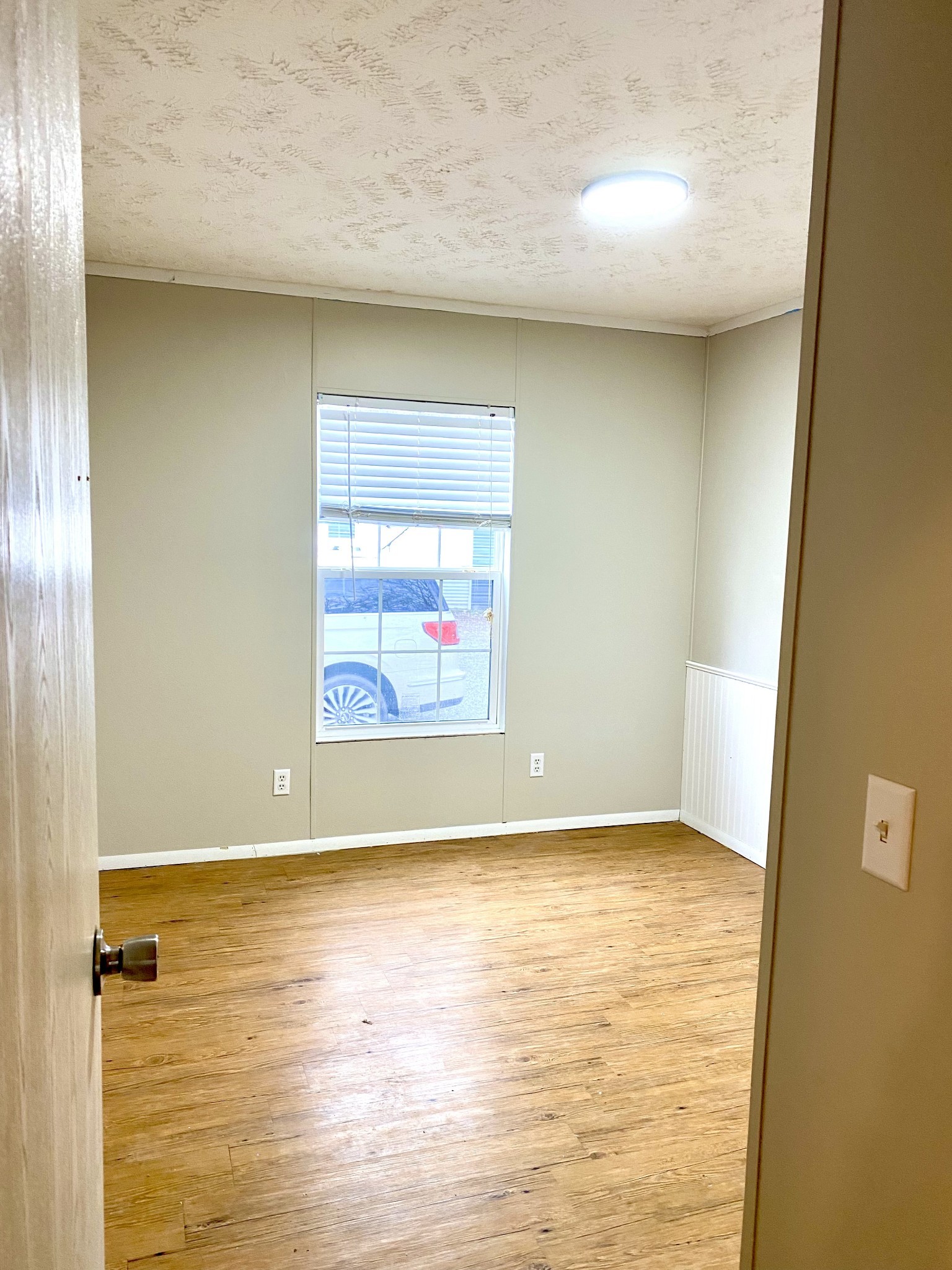 4619 Leanna Road Murfreesboro, TN 37129 - Photo 25 of 32 a view of an empty room with wooden floor and a window