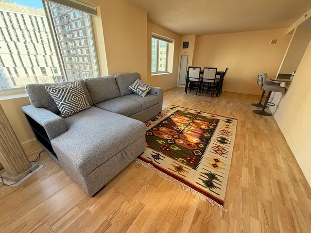 a living room with furniture and a table