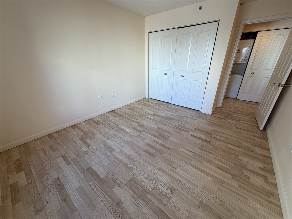 8 Museum Way, Unit 802 Cambridge, MA 02141 - Photo 20 of 39 a view of empty room with wooden floor