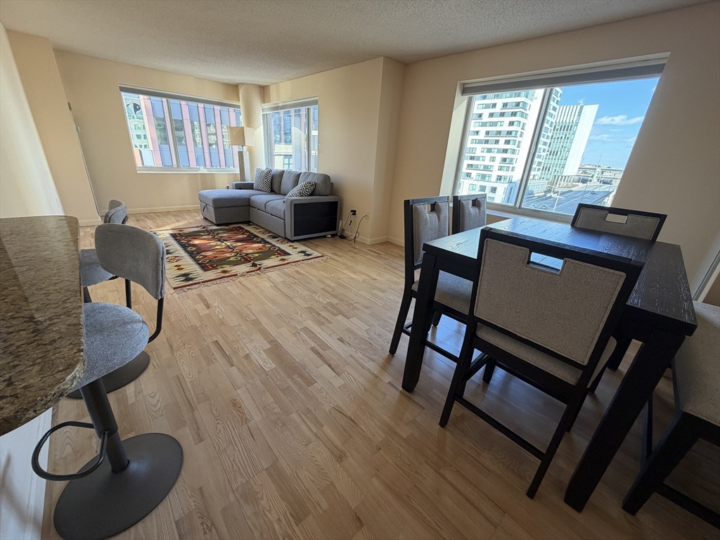 8 Museum Way, Unit 802 Cambridge, MA 02141 - Photo 2 of 39 a living room with furniture and a window