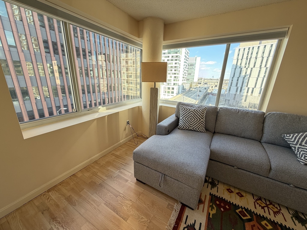 8 Museum Way, Unit 802 Cambridge, MA 02141 - Photo 4 of 39 a living room with furniture and a large window