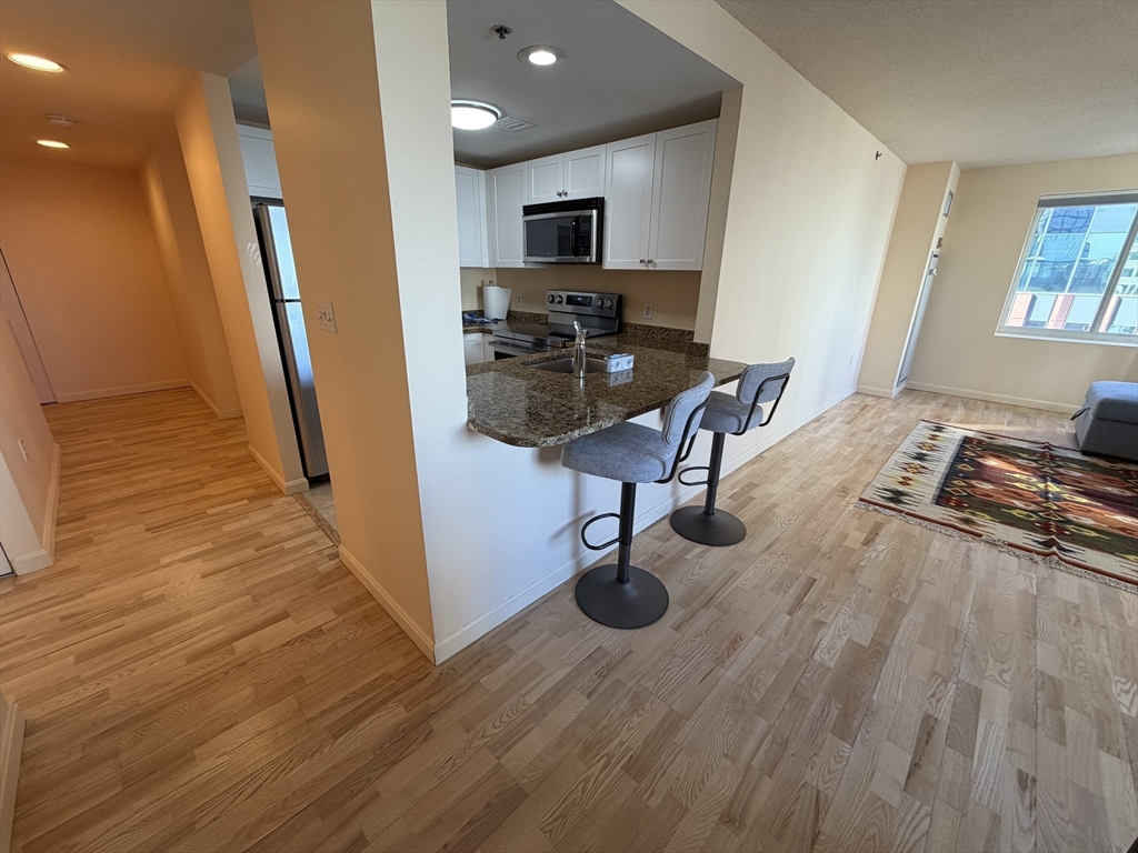 8 Museum Way, Unit 802 Cambridge, MA 02141 - Photo 8 of 39 a view of kitchen with sink and refrigerator