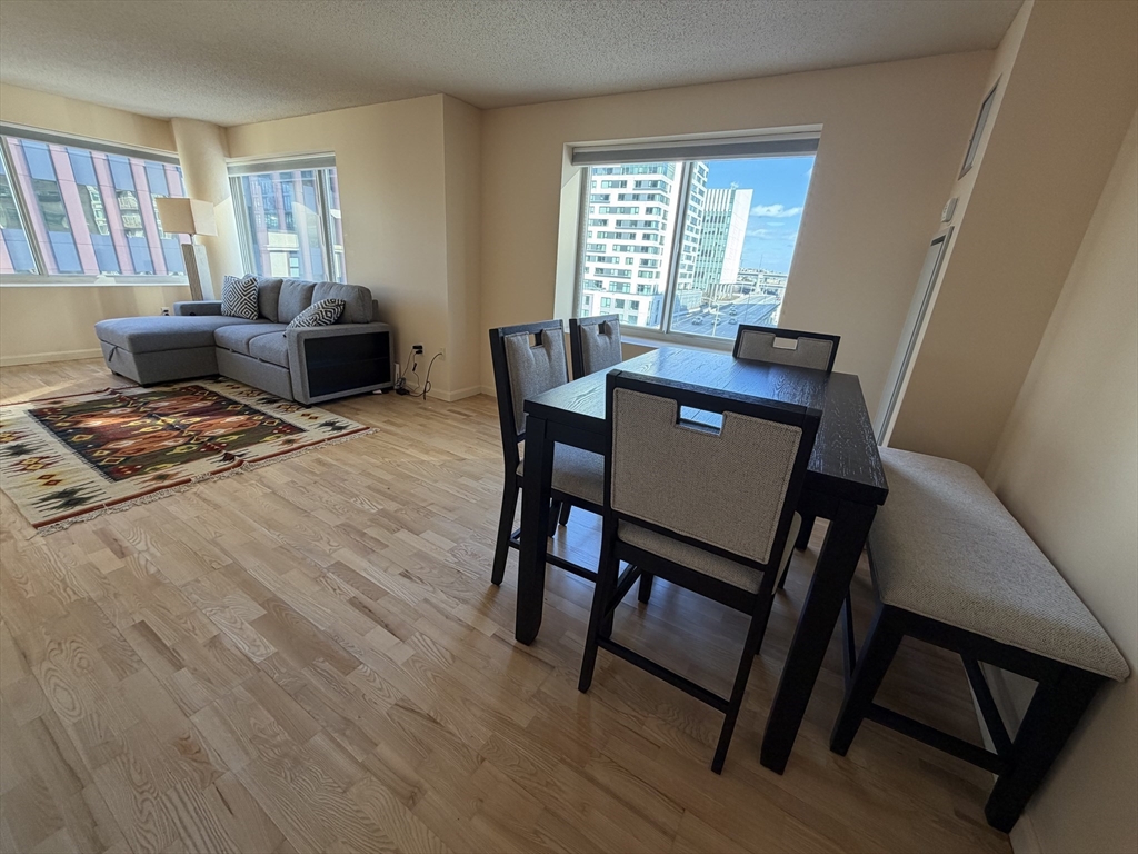 8 Museum Way, Unit 802 Cambridge, MA 02141 - Photo 9 of 39 a view of a dining room with furniture window and wooden floor