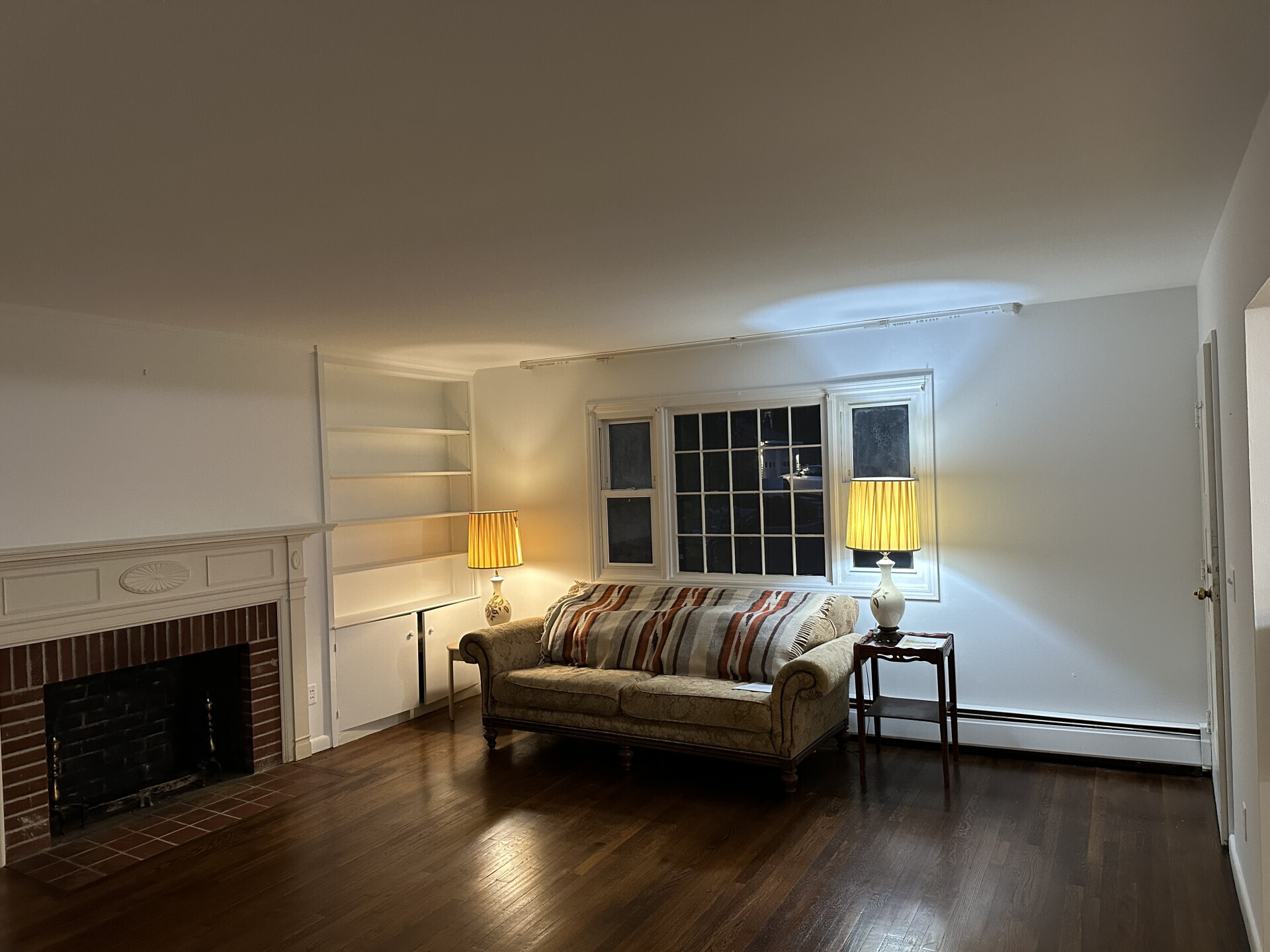 10 Carleton Street Greenwich, CT 06830 - Photo 5 of 8 a living room with furniture and a fireplace